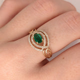 Celtic Inspired East West Emerald and Diamond Ring