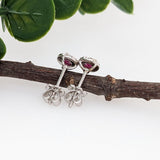 Pretty Round Ruby Studs with Diamond Halo