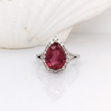 Pear Shaped Pink Tourmaline W a Mixed Baguette and Round Diamond Halo Ring in 14K White Gold | Pear