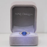14K white gold blue star sapphire cabochon ring with diamonds