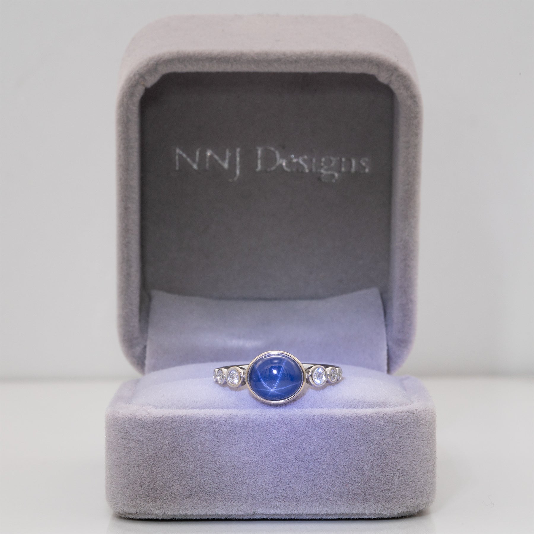 14K white gold blue star sapphire cabochon ring with diamonds