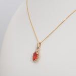 14K yellow gold padparadscha sapphire pendant