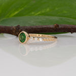 14K yellow gold tsavorite garnet round ring with diamond accents