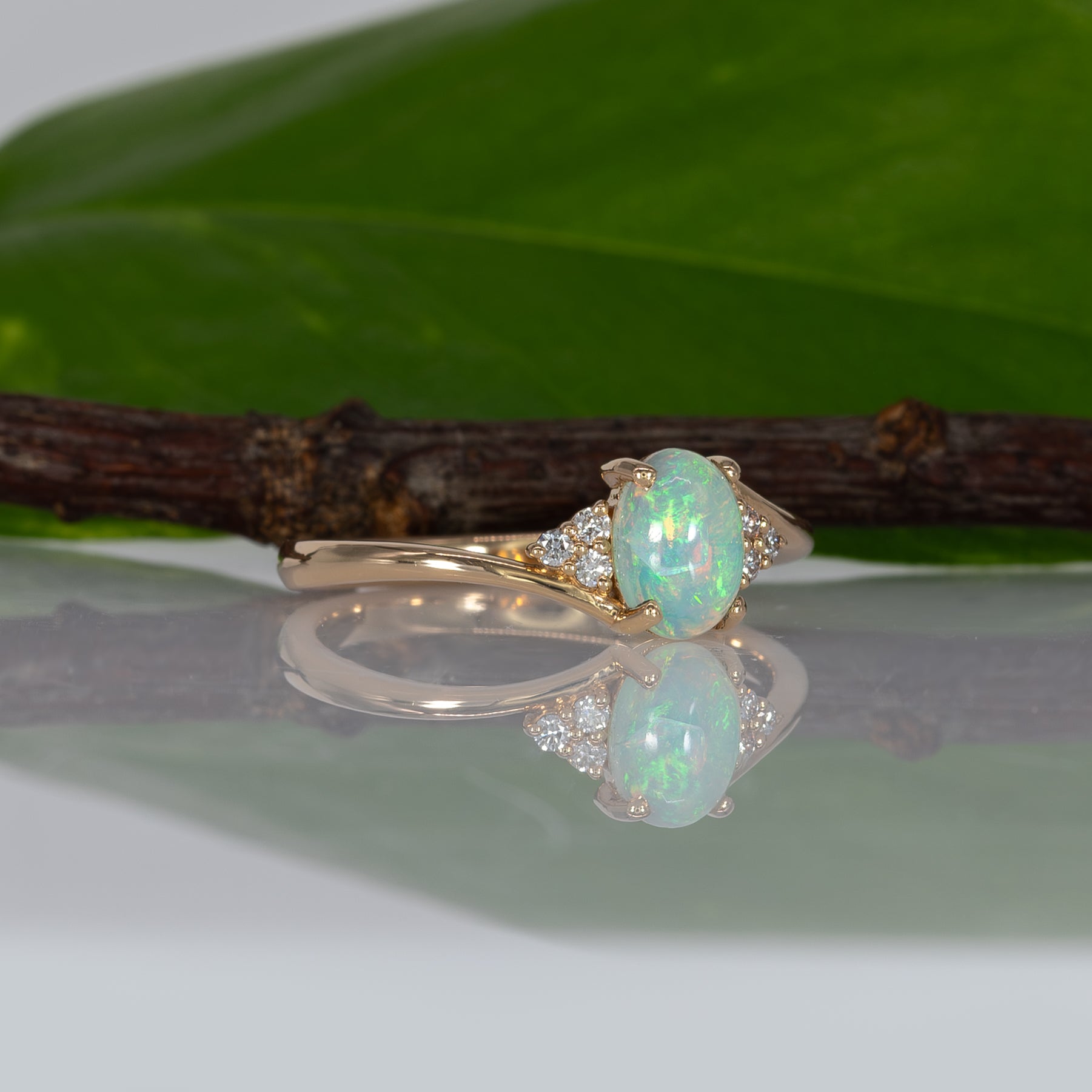14K yellow gold Ethiopian opal cabochon ring with diamond accents