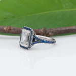 platinum lab grown diamond ring with blue sapphire accents