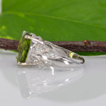 14K white gold peridot oval ring with diamond halo