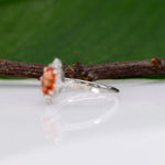14K white gold padparadscha sapphire ring with diamond halo