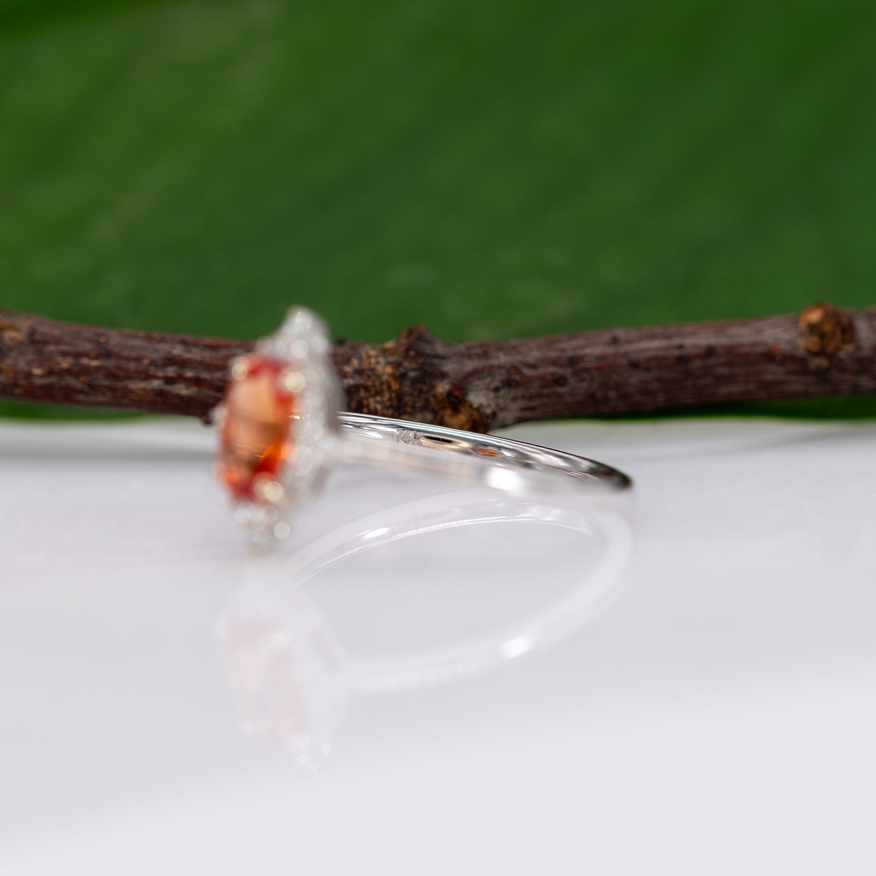 14K white gold padparadscha sapphire ring with diamond halo