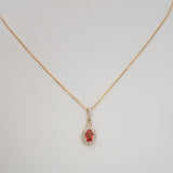 14K yellow gold padparadscha sapphire pendant
