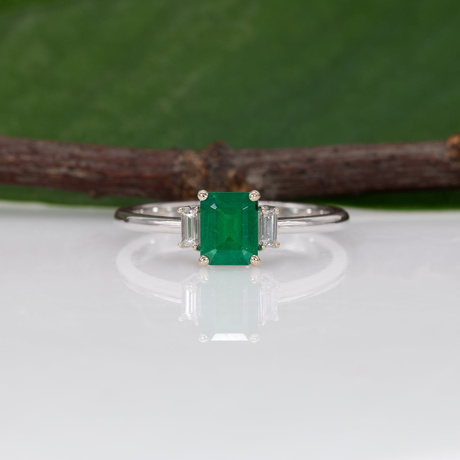 14K white gold Colombian emerald ring with diamond accents