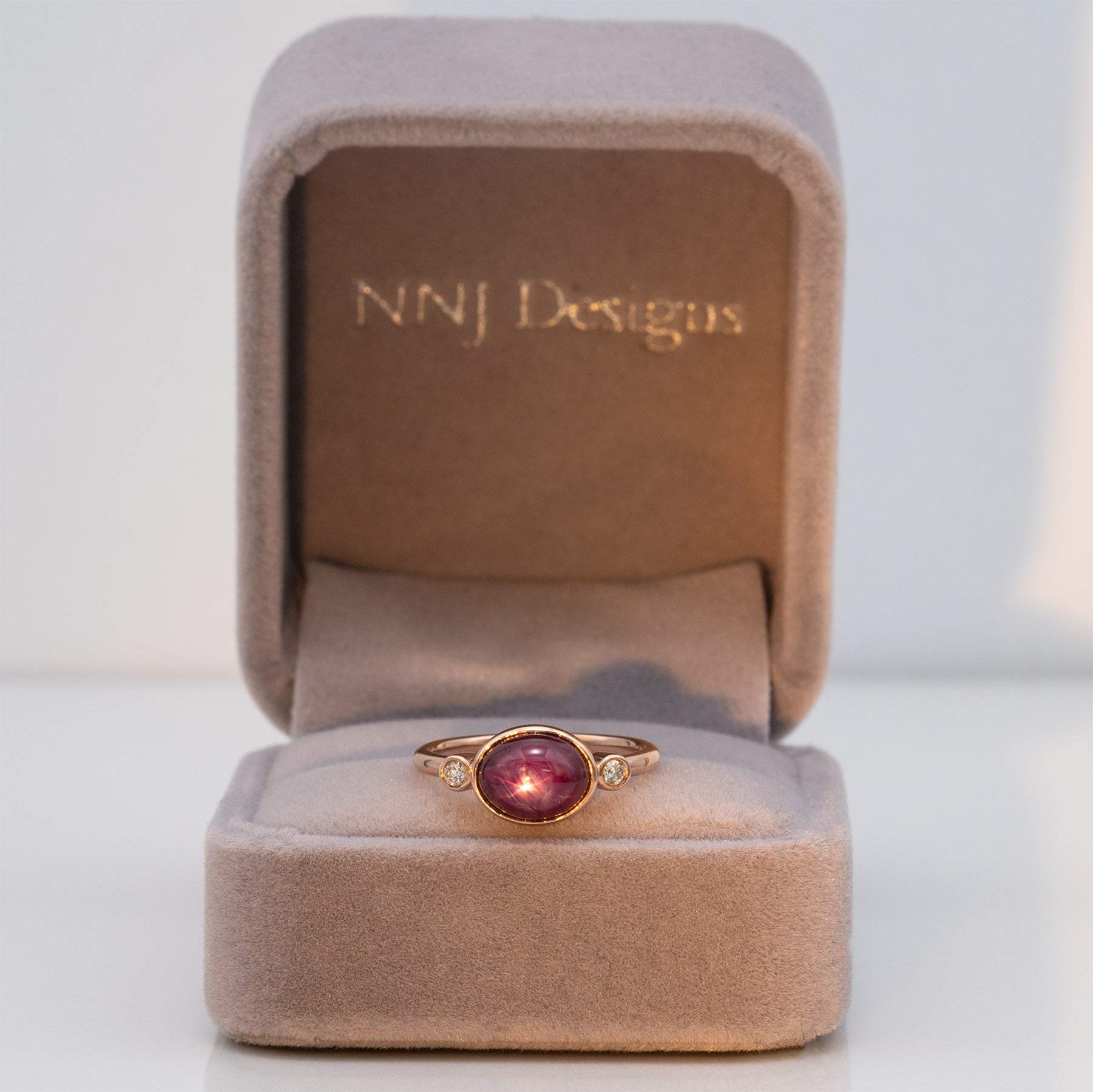 14K rose gold star ruby cabochon ring with diamond accents