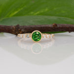 14K yellow gold tsavorite garnet round ring with diamond accents