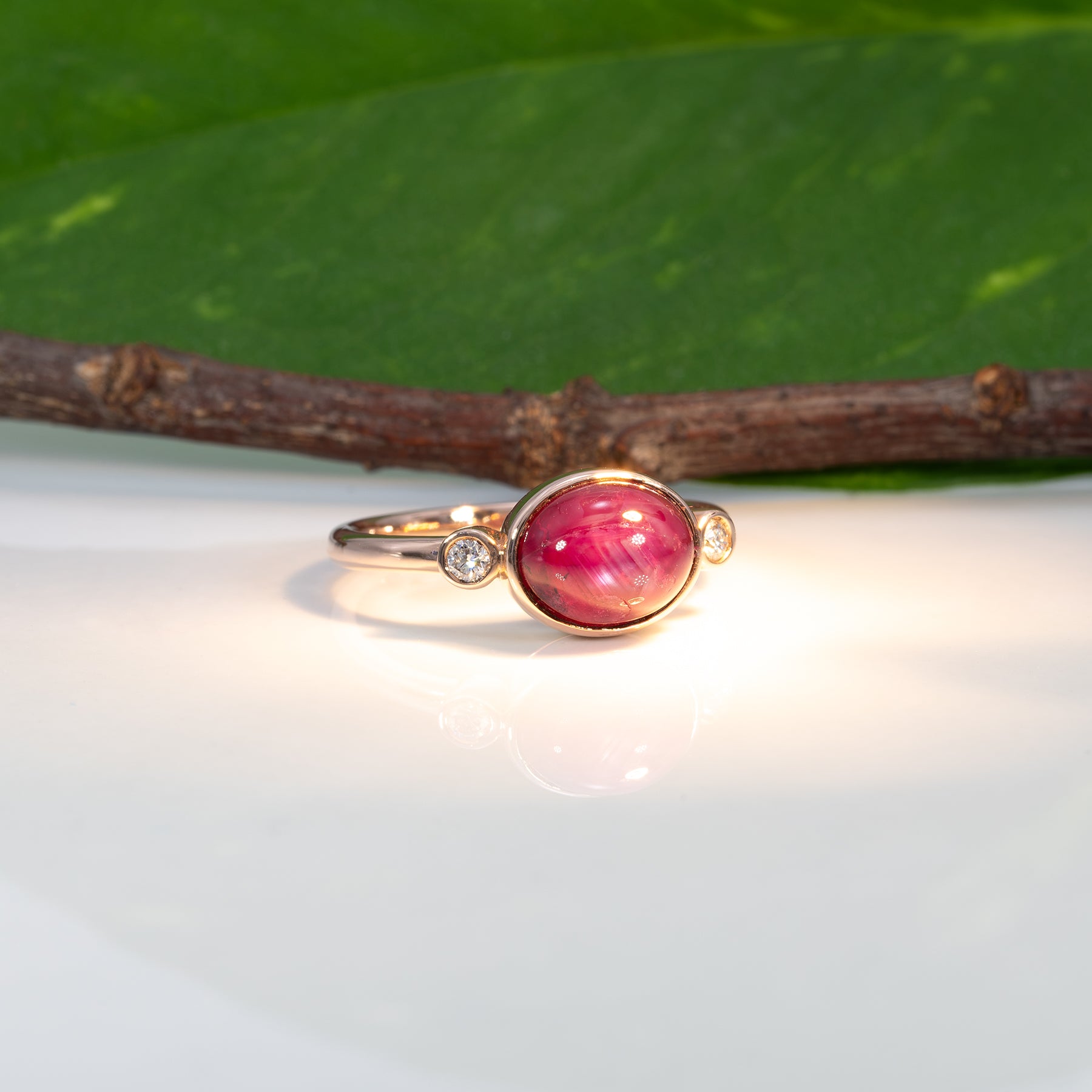 14K rose gold star ruby cabochon ring with diamond accents