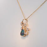 14K yellow gold boulder opal pendant