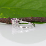 14K white gold pink sapphire pear ring with diamond halo