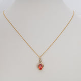 14K yellow gold padparadscha sapphire pendant