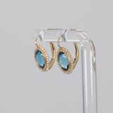 14K yellow gold London blue topaz oval stud earrings with diamond halo