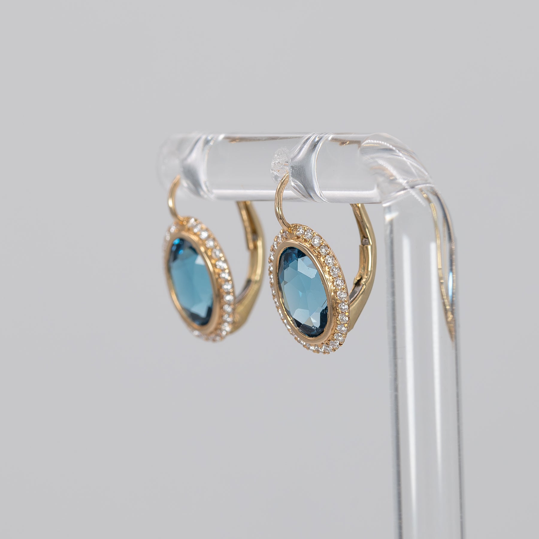 14K yellow gold London blue topaz oval stud earrings with diamond halo
