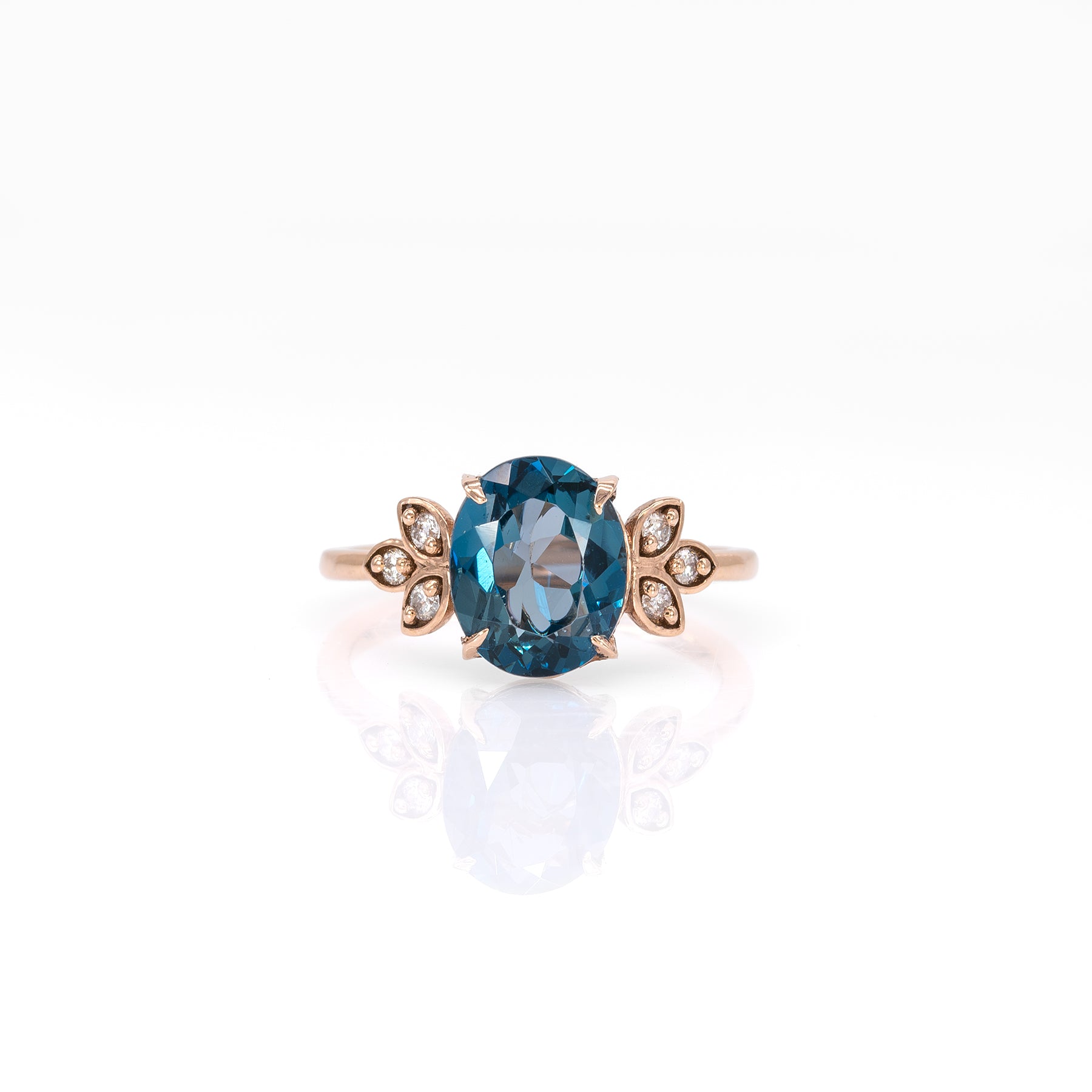 14K rose gold London blue topaz ring with diamond accents