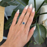 14K white gold teal sapphire oval ring with diamond halo