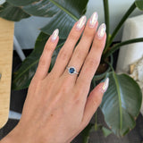 14K white gold teal sapphire oval ring with diamond halo
