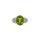 14K white gold peridot oval ring with diamond halo