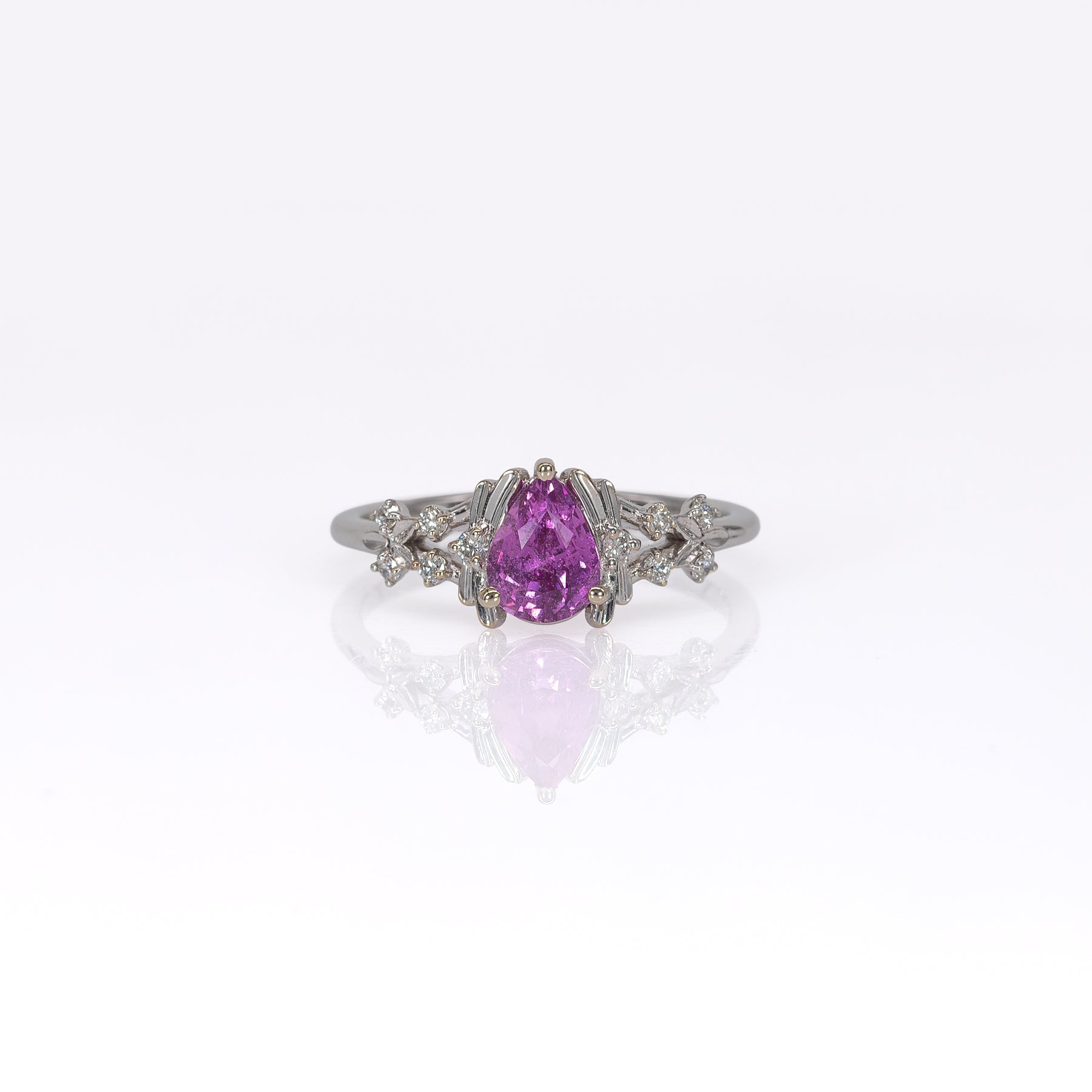14K white gold pink sapphire pear ring with diamond halo