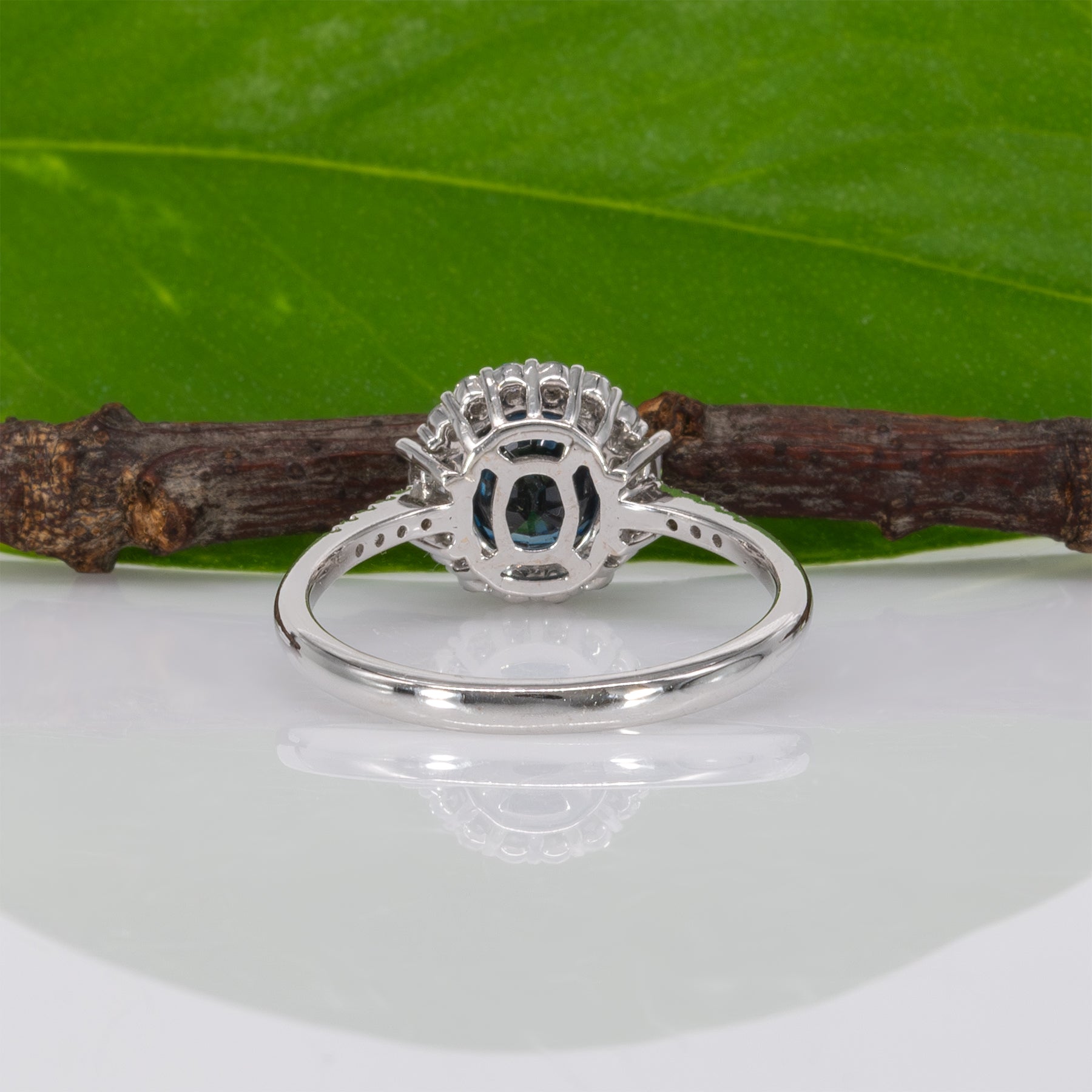 14K white gold teal sapphire oval ring with diamond halo
