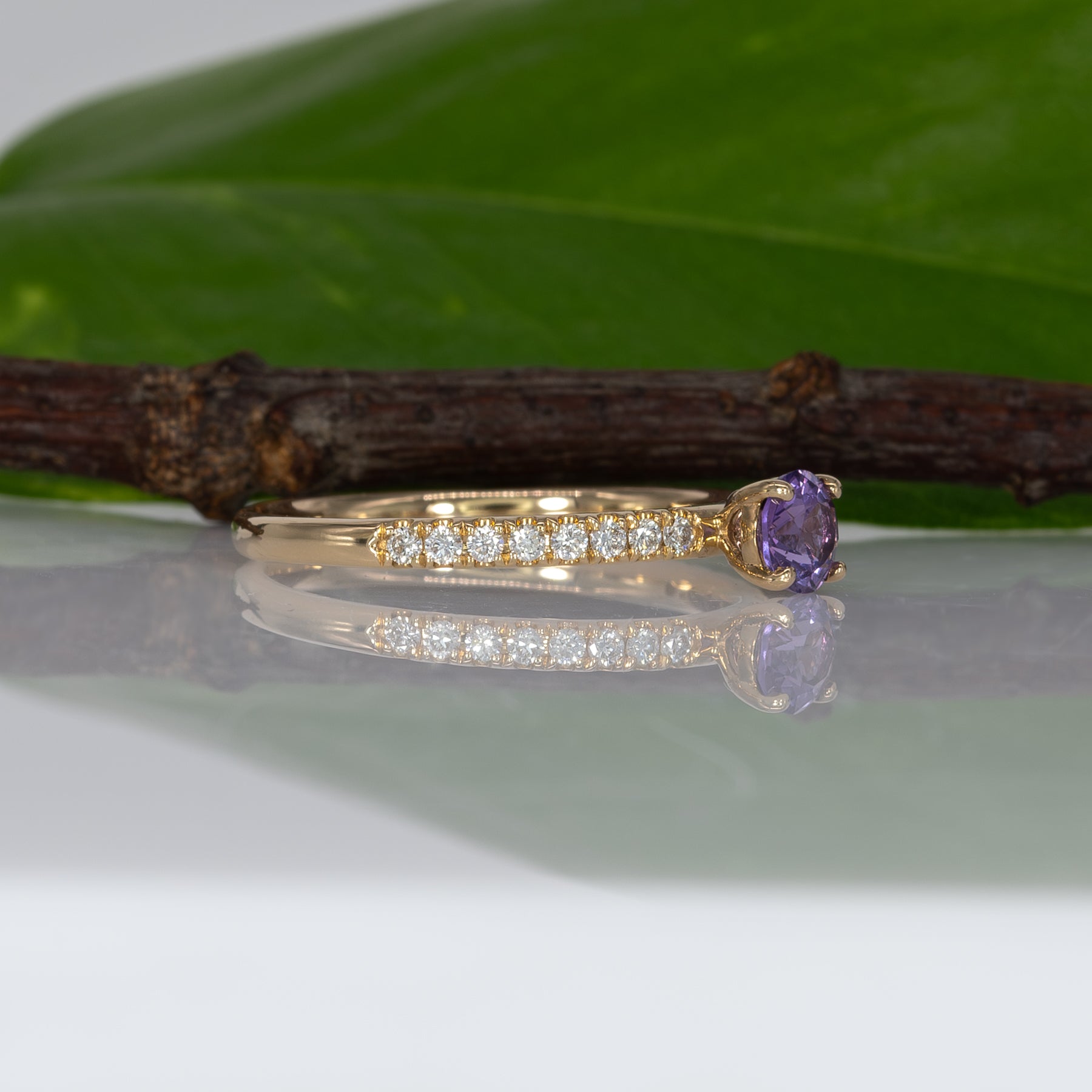 14K yellow gold purple sapphire round ring with diamond halo