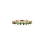 14K yellow gold band with round Zambian emerald accents