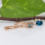 14K rose gold London blue topaz oval earrings with diamond accents