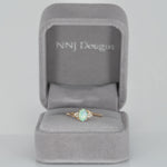 14K yellow gold Ethiopian opal cabochon ring with diamond accents