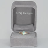 14K yellow gold Ethiopian opal cabochon ring with diamond accents