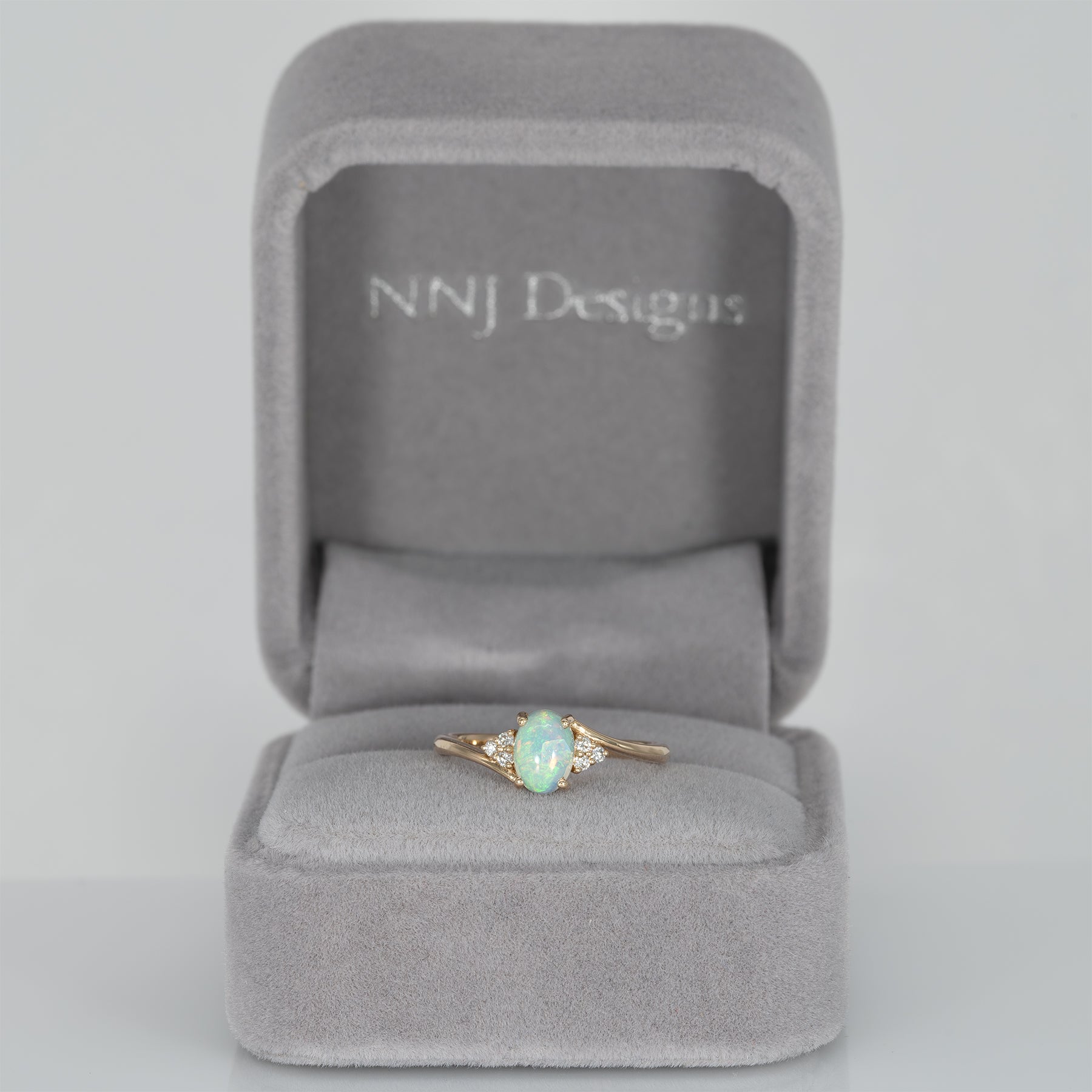 14K yellow gold Ethiopian opal cabochon ring with diamond accents