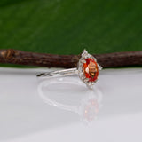 14K white gold padparadscha sapphire ring with diamond halo