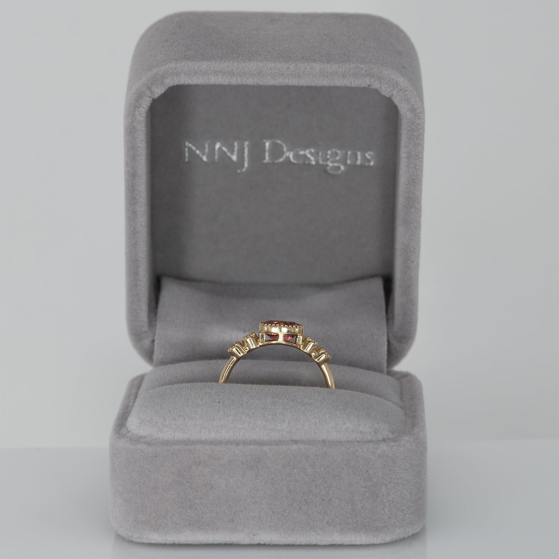 14K yellow gold padparadscha sapphire oval ring with diamond accents