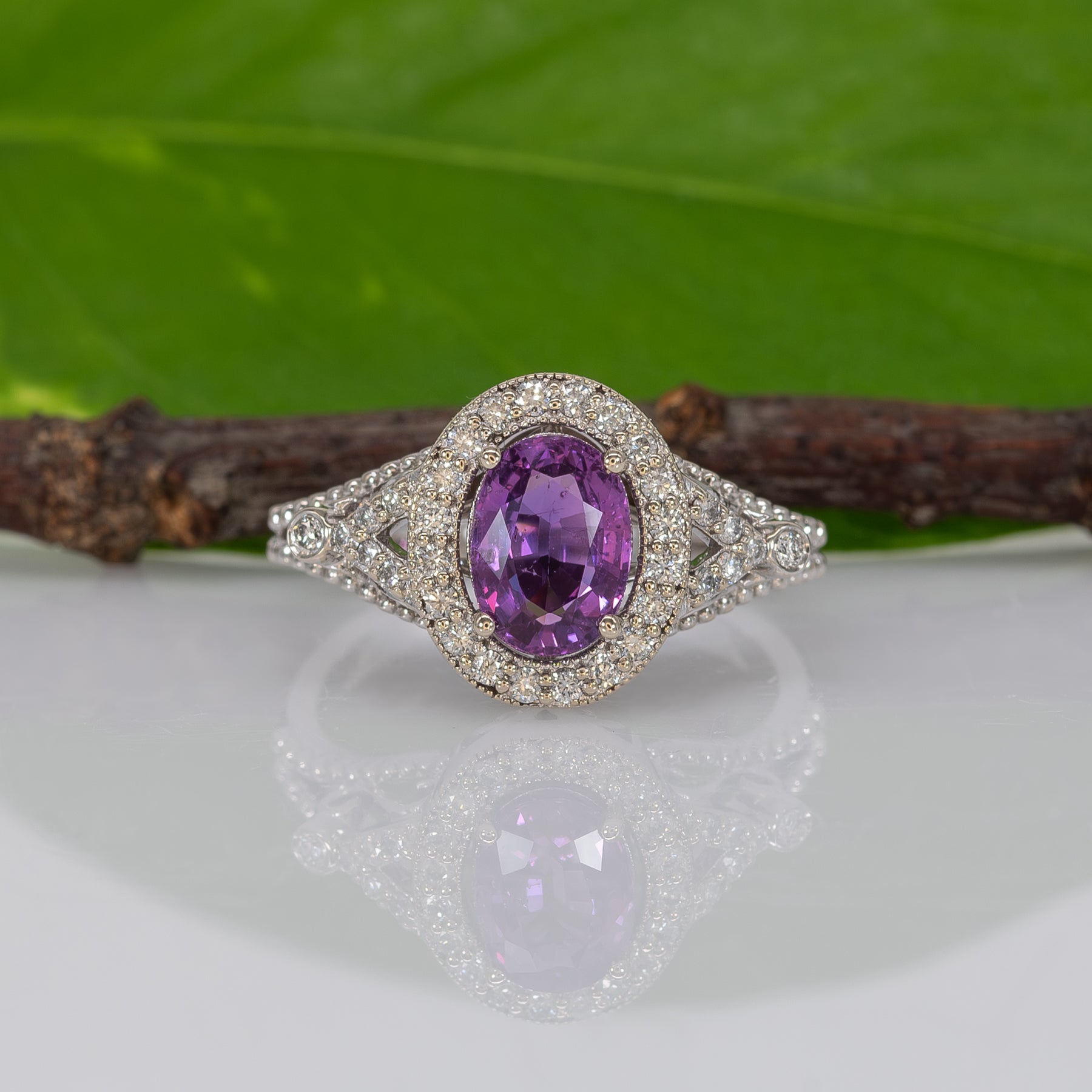 14K white gold pink sapphire oval ring with diamond halo