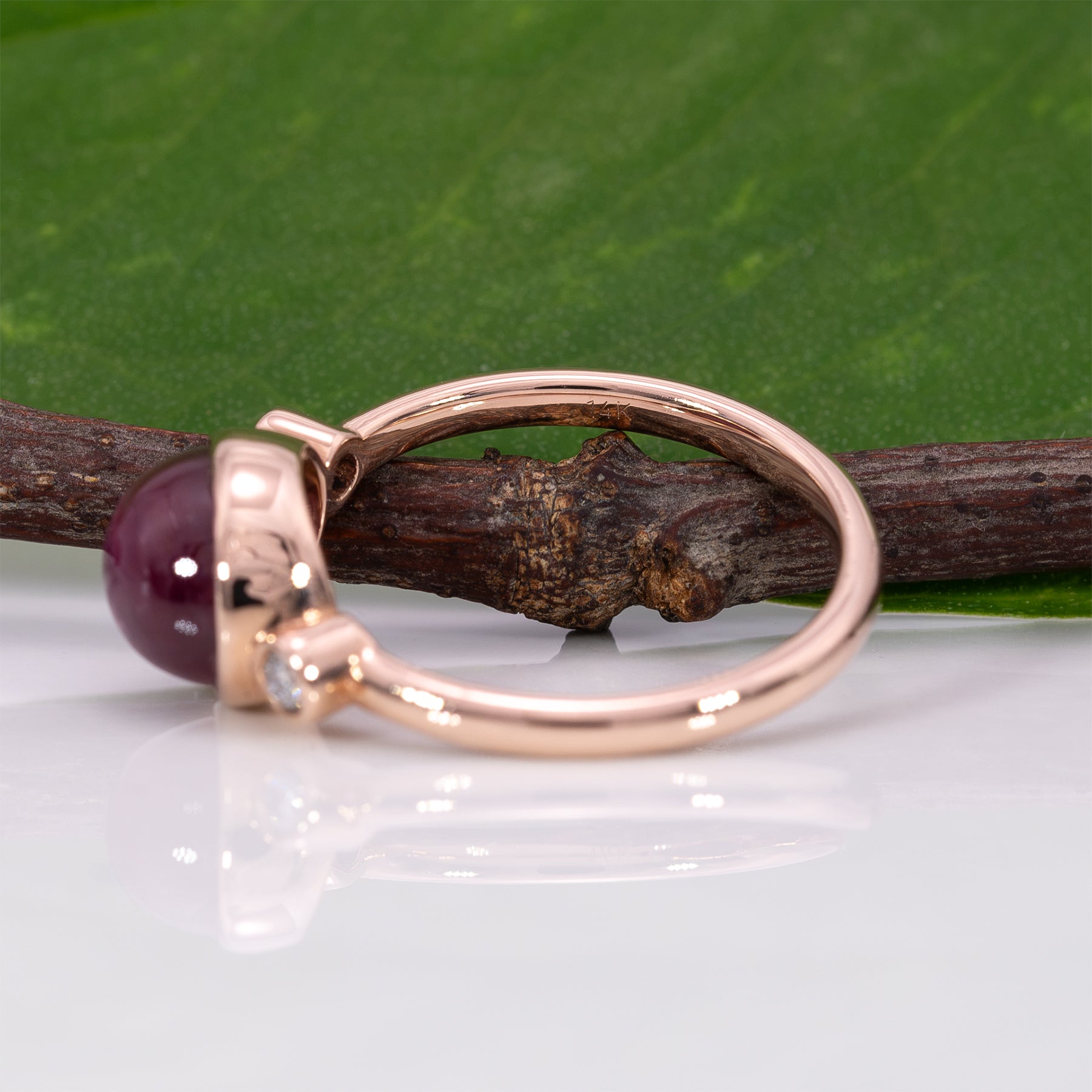 14K rose gold star ruby cabochon ring with diamond accents