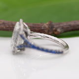 platinum lab grown diamond ring with blue sapphire accents