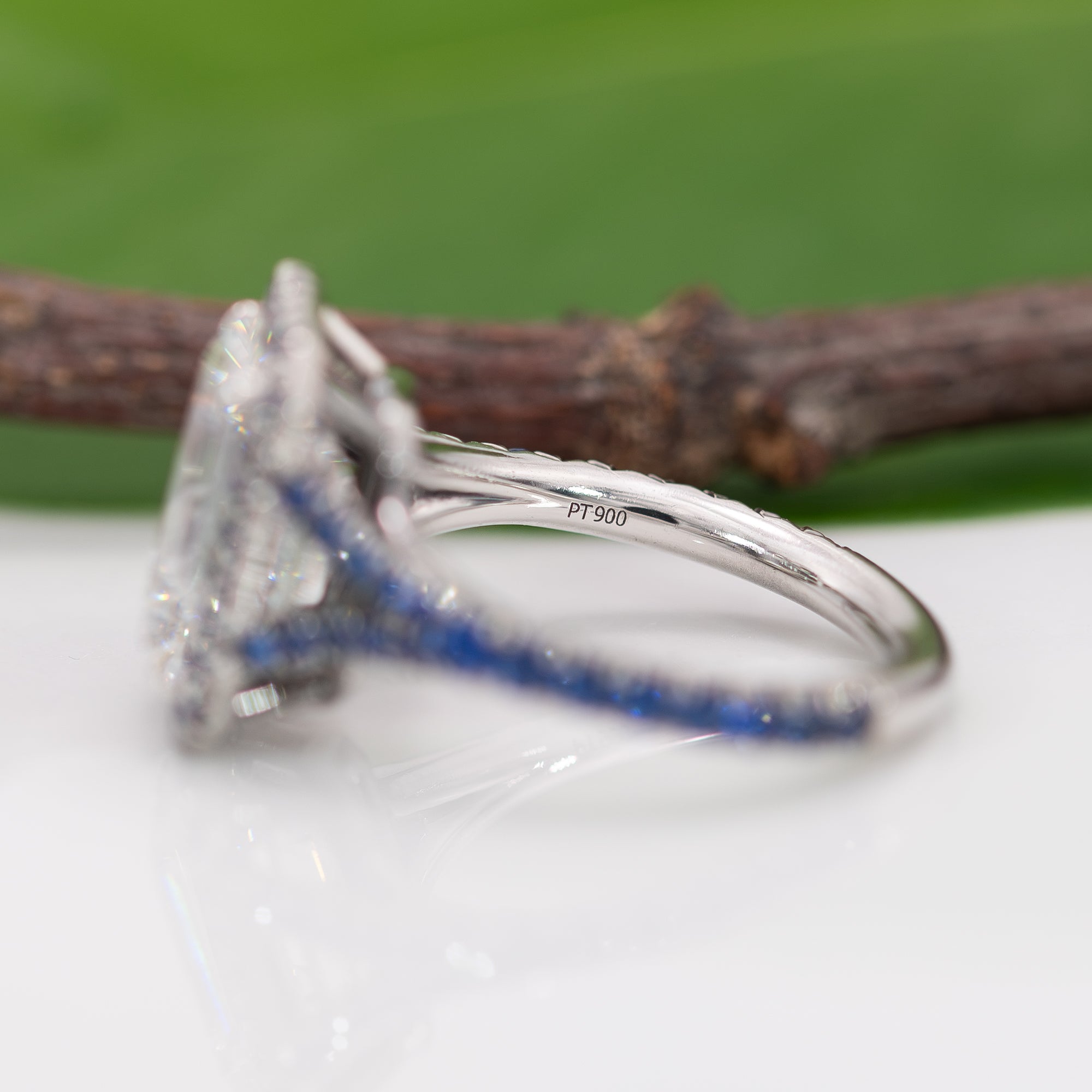 platinum lab grown diamond ring with blue sapphire accents
