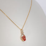 14K yellow gold padparadscha sapphire pendant