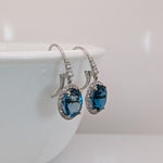 London Blue Topaz Stud Earrings in 14K White Gold | Diamond Accents | Oval Cut | 11x9mm | November Birthstone