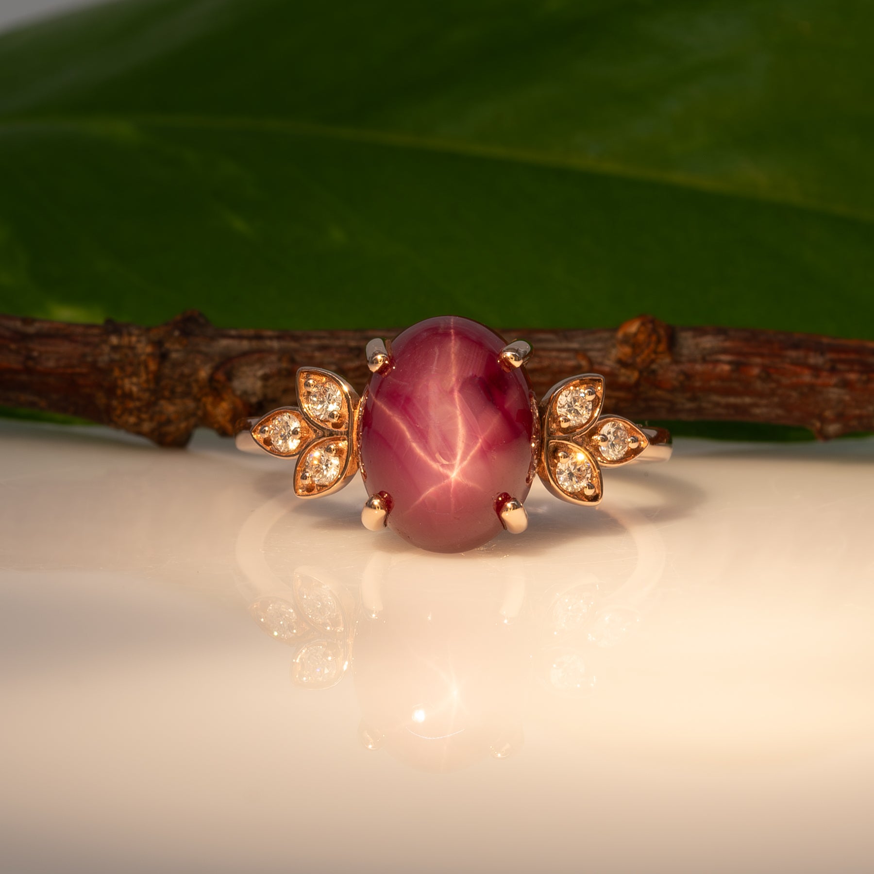 14K rose gold star ruby cabochon ring with diamond accents
