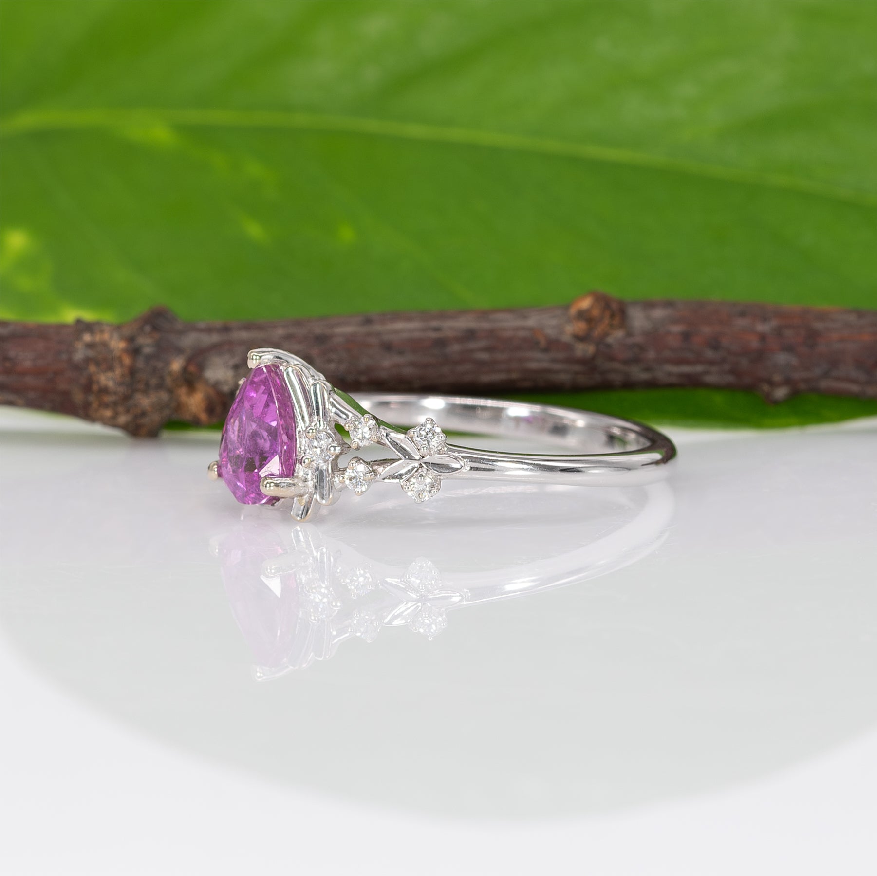 14K white gold pink sapphire pear ring with diamond halo