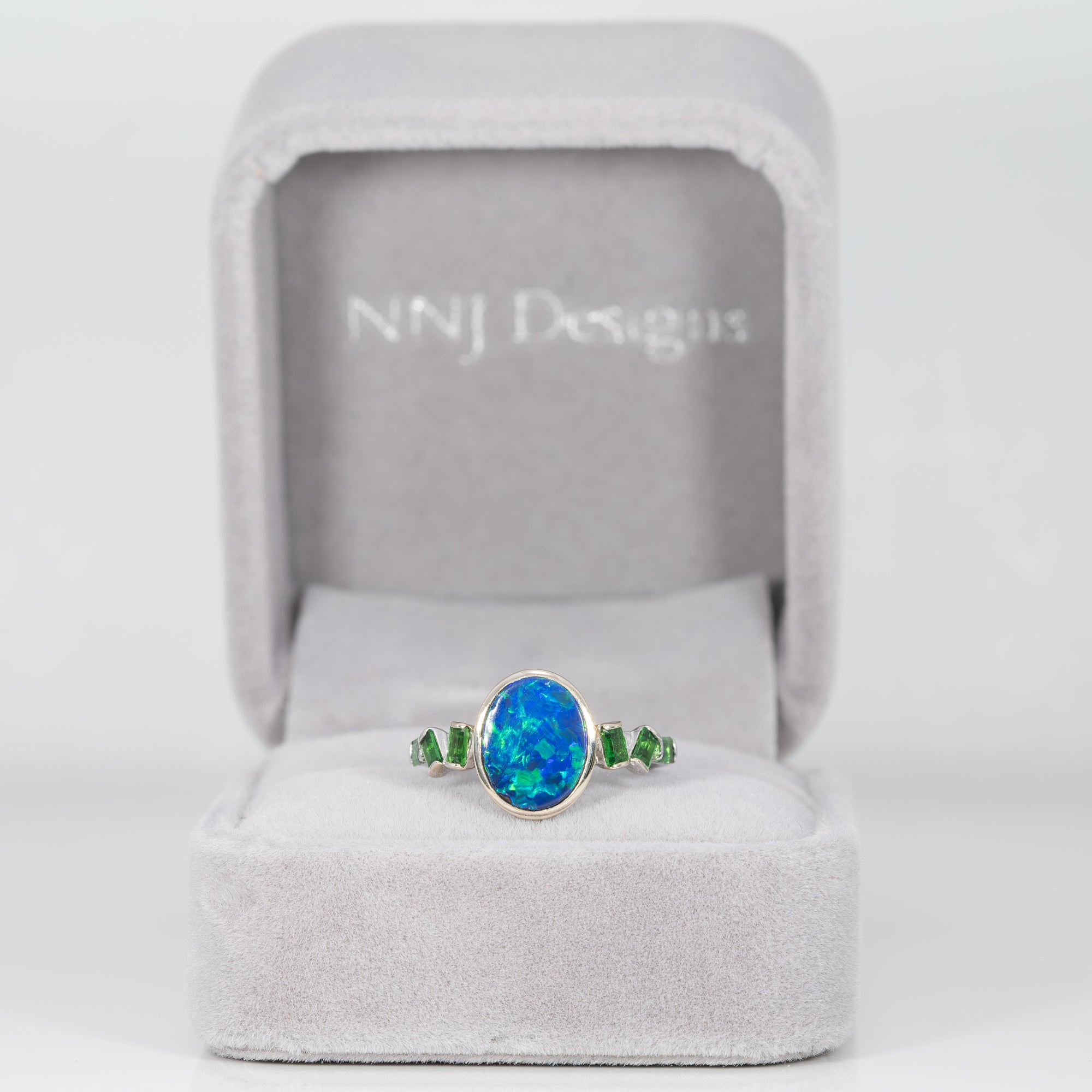 14K white gold boulder opal cabochon ring with tsavorite accents