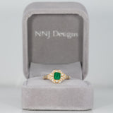 14K yellow gold Colombian emerald ring with diamond accents