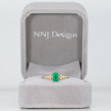 14K yellow gold colombian emerald ring with diamond accents