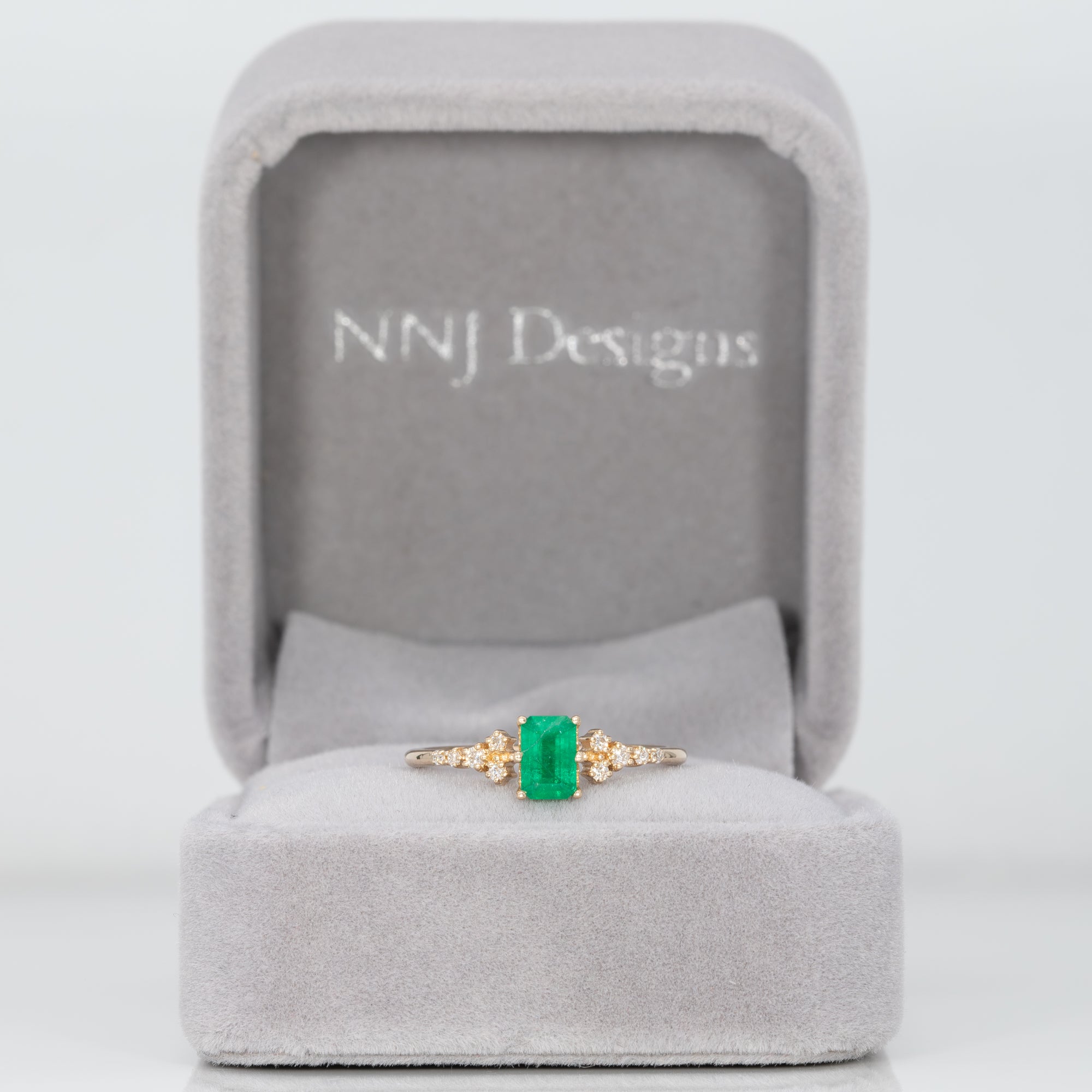 14K yellow gold colombian emerald ring with diamond accents