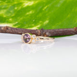 14K yellow gold bezel-set purple spinel ring with diamond accents