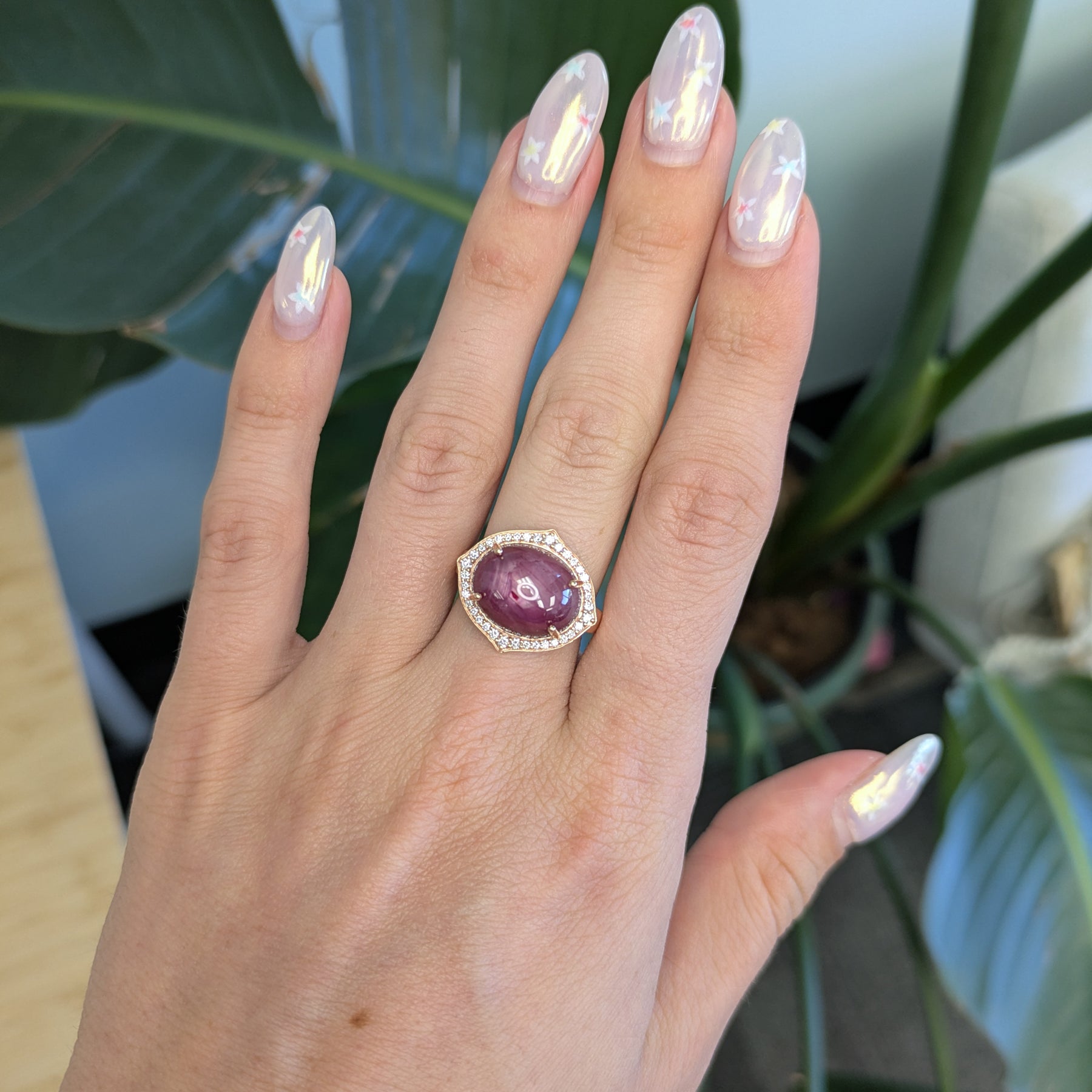 14K rose gold star ruby cabochon ring with diamond halo